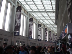 Inside the main gate at Yankee Stadium.  Very large and full of banners and signs.